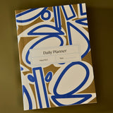 brown and blue abstract daily planner