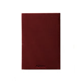A dark burgundy textured linen notebook cover with the brand name Papersmiths embossed at the bottom, shown against a plain white background.